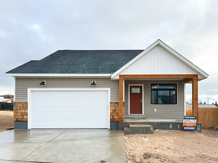 New single-family home for sale at 115 Kachina Dr., Evanston WY featuring attached two-car garage and covered front porch | Smart Dwellings